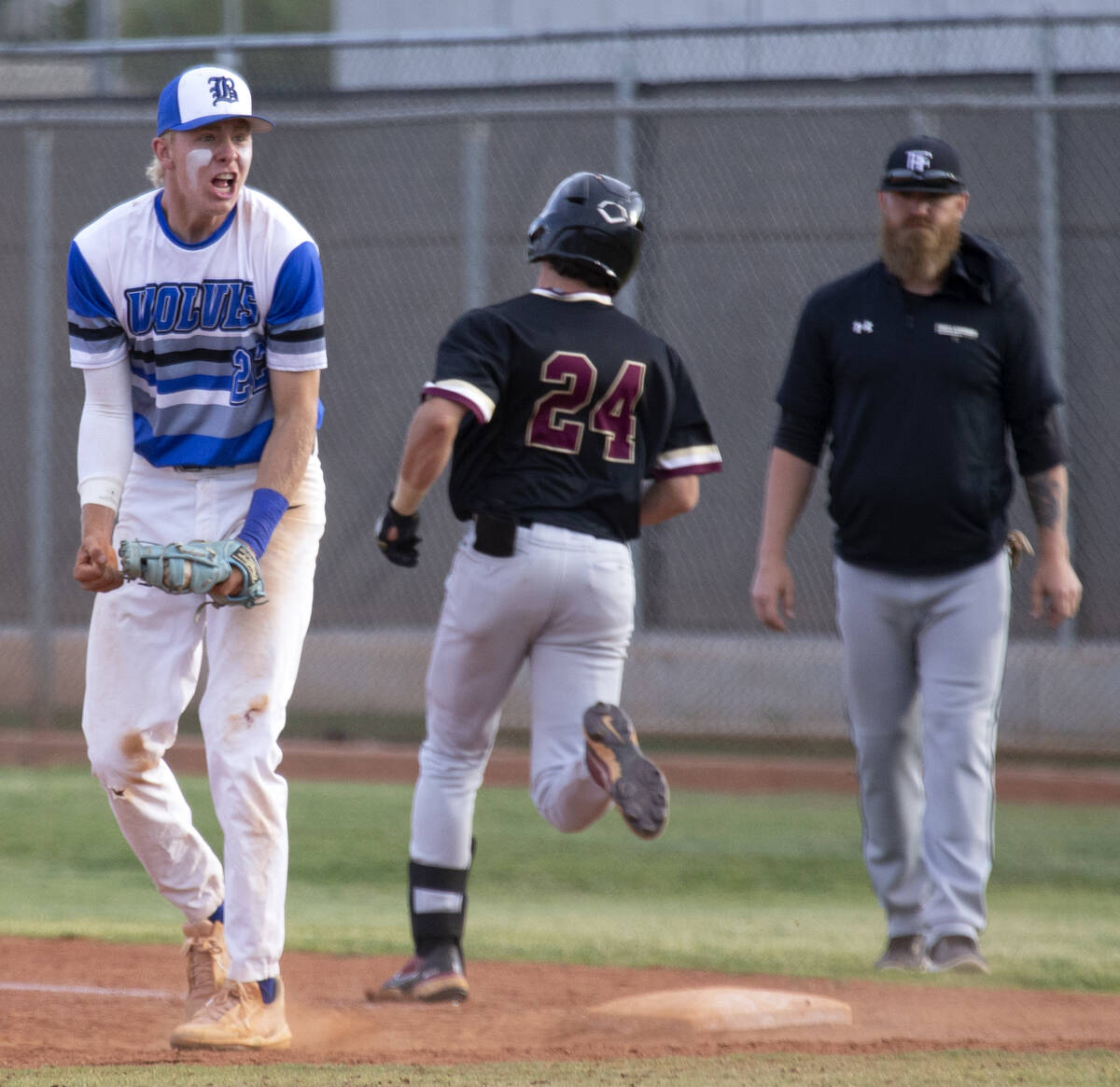 Basic first baseman Cooper Sheff (22) celebrates after making the final out while Faith Luthera ...