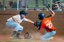 Brewers pitcher Andrew Kim (10) tags out Giants runner Steven Reagan (25) at home plate during ...