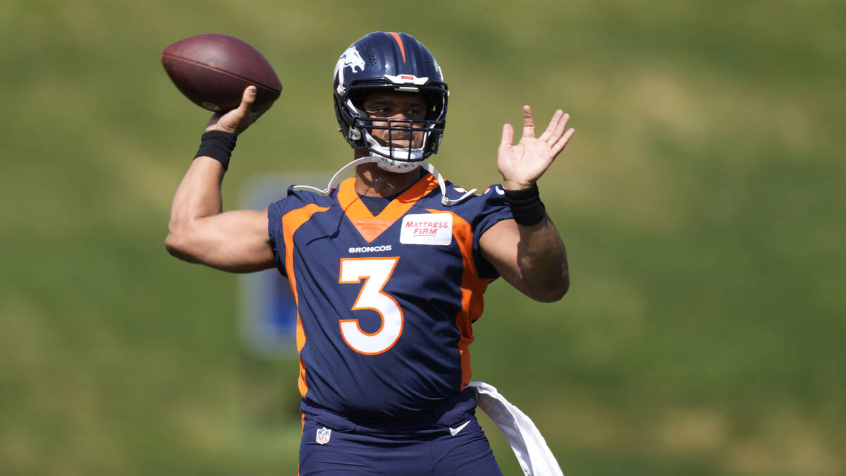 Denver Broncos quarterback Russell Wilson takes part in drills at the NFL football team's volun ...