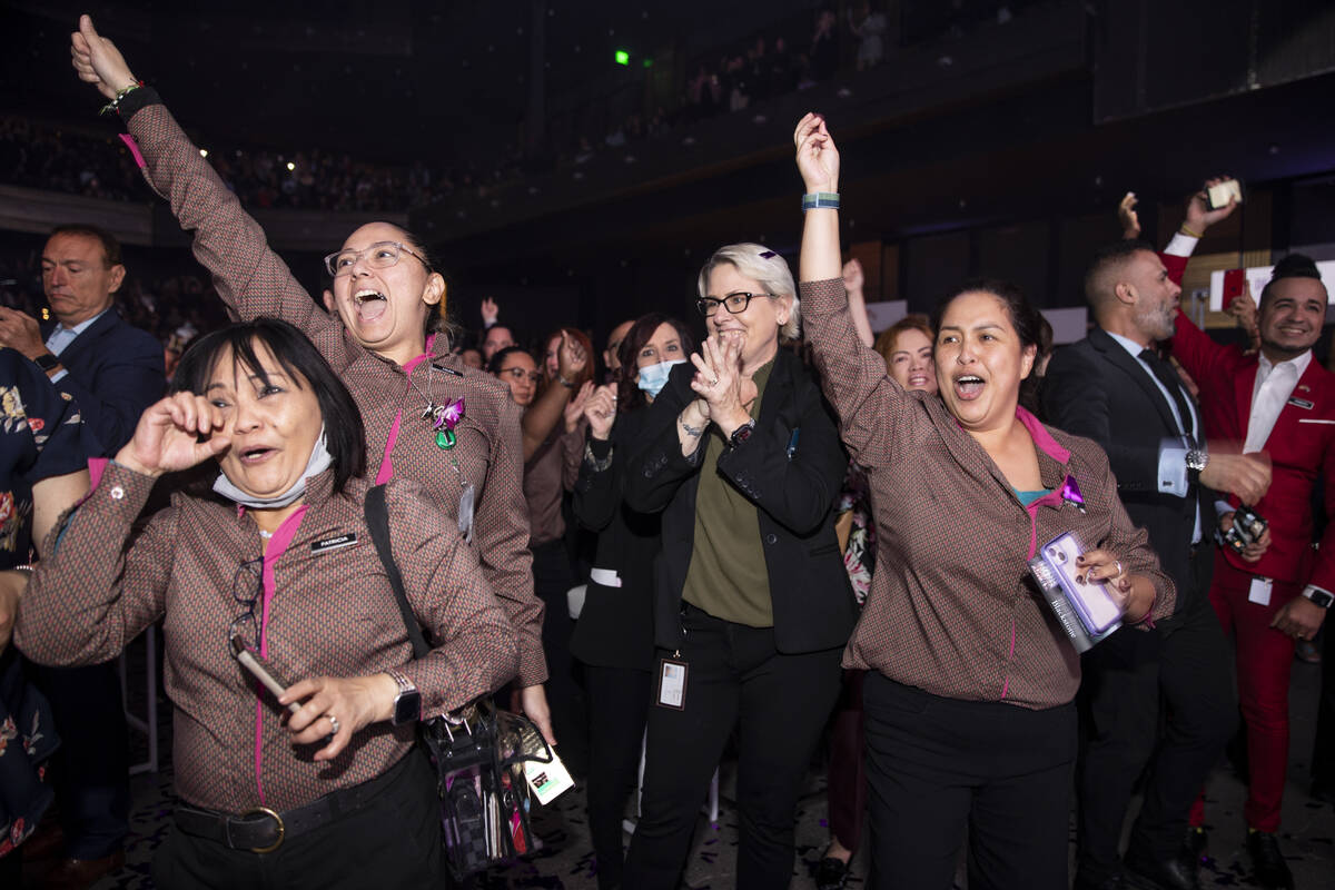 Cosmopolitan of Las Vegas employees celebrate after they were awarded a $5000 bonus during an e ...