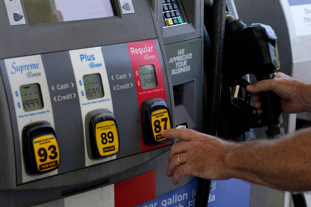 A customer pumps gas at an Exxon gas station, Tuesday, May 10, 2022, in Miami. U.S consumers ha ...
