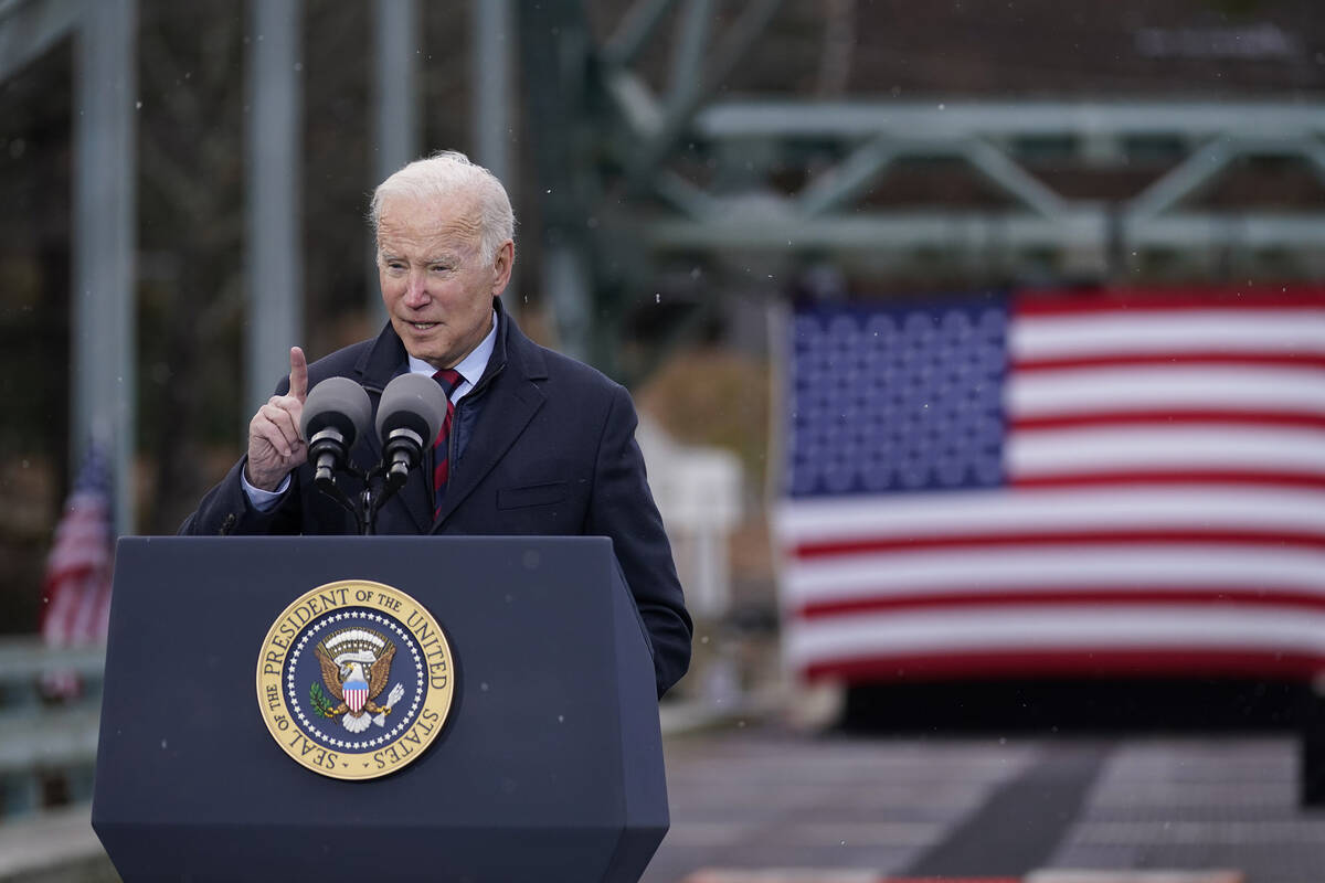 President Joe Biden speaks during a visit to the NH 175 bridge over the Pemigewasset River to p ...