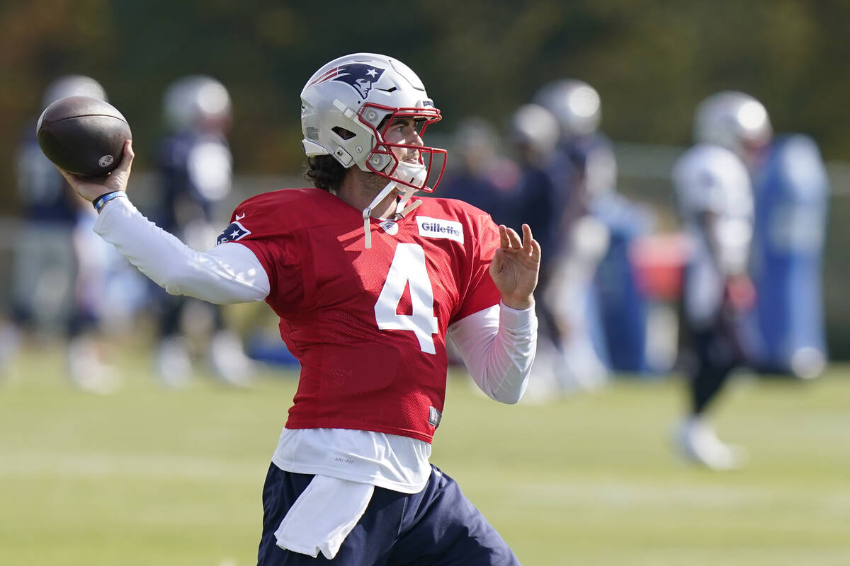 New England Patriots quarterback Jarrett Stidham (4) winds up to pass during an NFL football pr ...