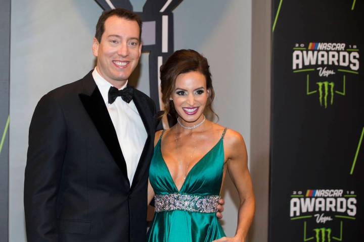 Kyle and Samantha Busch take photos during the Fan Red Carpet on Thursday, Nov. 29, 2018, at Wy ...