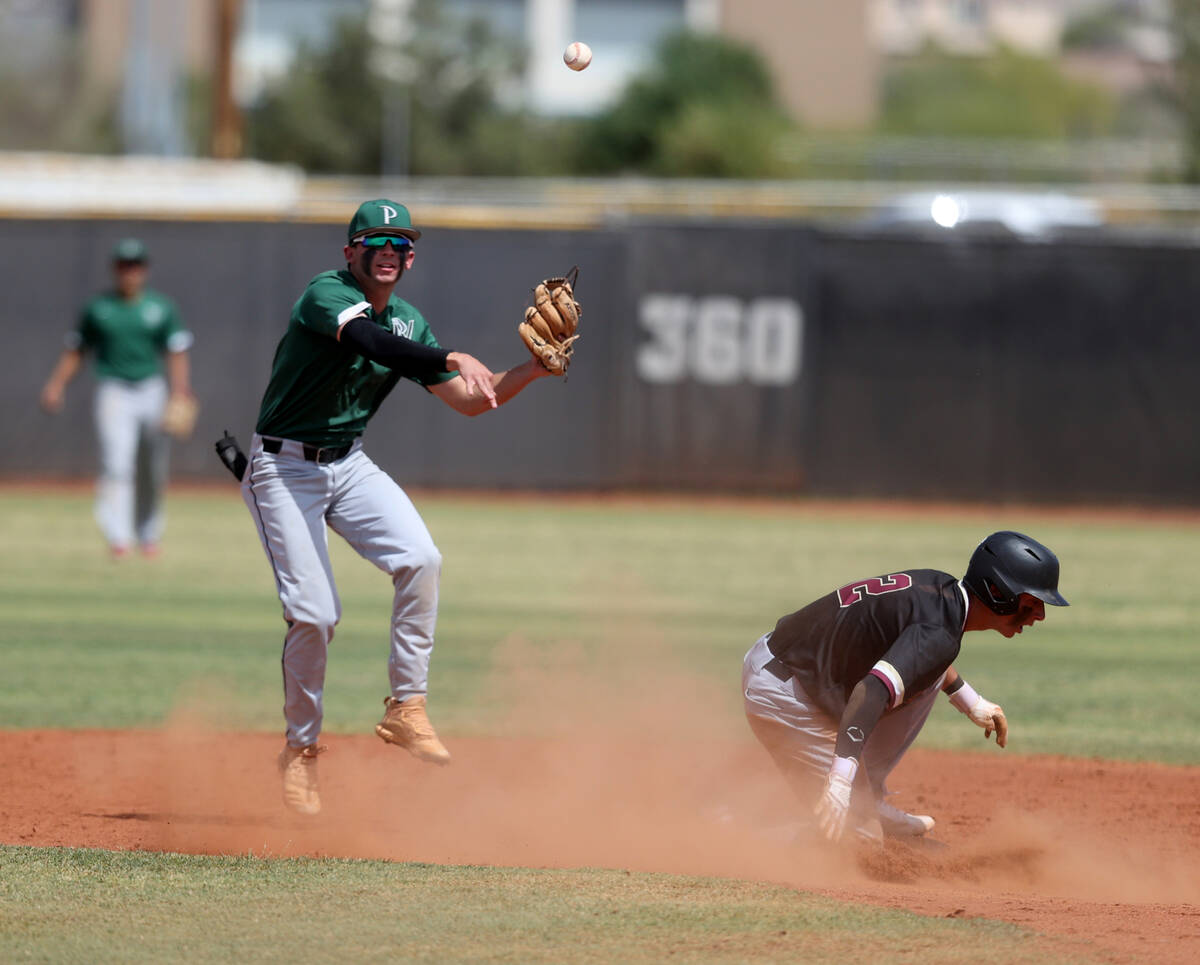 Palo Verde second baseman Jackson Tanko (14) tries to turn a double play after getting out Fait ...