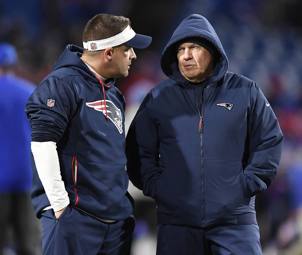 New England Patriots head coach Bill Belichick, right talks with offensive coordinator Josh McD ...