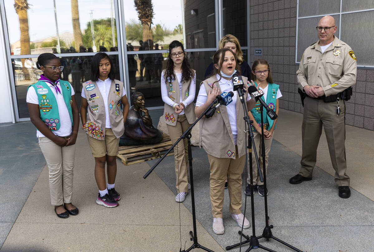 Khloee, 12, of Girl Scout Troop 702, talks about the recovery of the statue “In Grace&#x ...