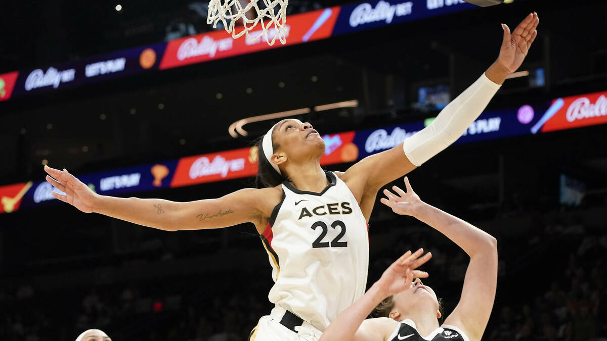 Las Vegas Aces' A'ja Wilson (22) looks to pass during a WNBA basketball game against the Phoeni ...