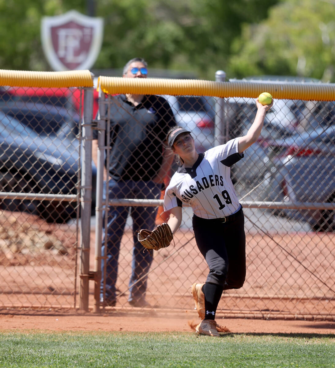 Faith Lutheran McKenna Young (19) throws a ball in from the fence against Green Valley in the 2 ...