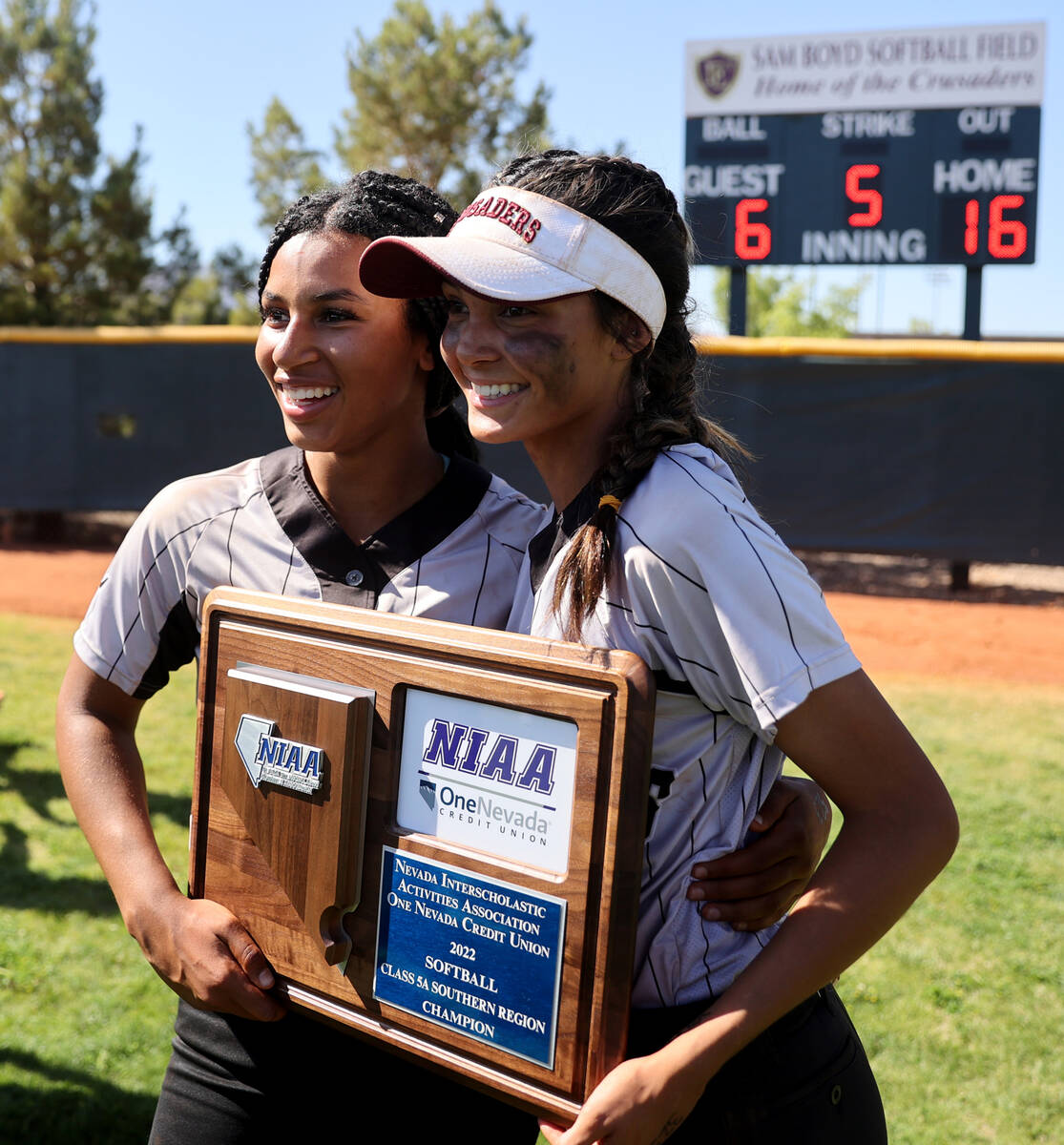 Faith Lutheran pitcher Ava Walker, left, and catcher Jill Molnar, celebrate beating Green Valle ...