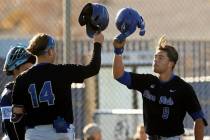 Sierra Vista’s J.T. Starkus (9) celebrates with teammate Mikey Clark (14) after hitting a hom ...