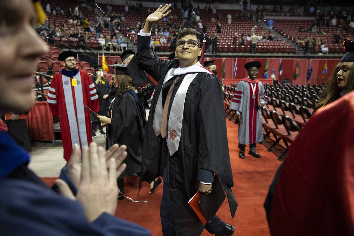 Postgraduate German Martinez participates during an UNLV commencement ceremony at the Thomas &a ...