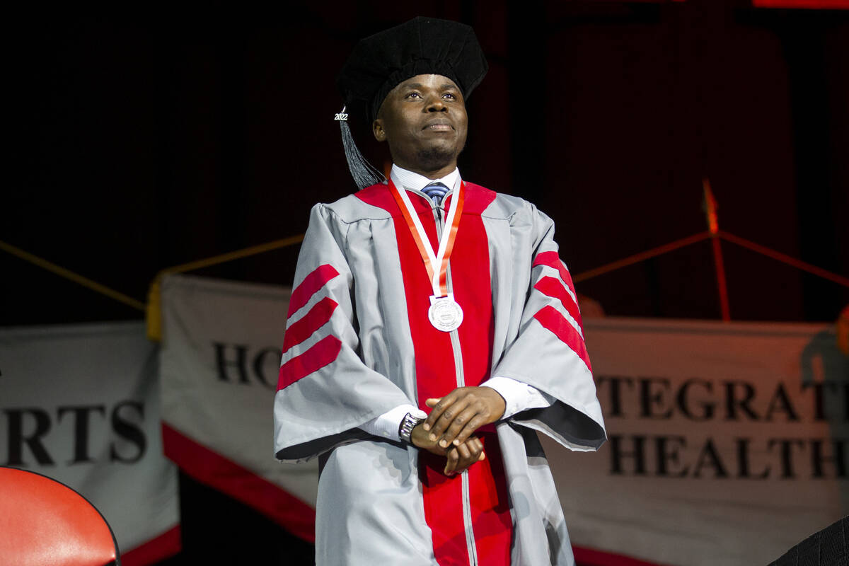 Postgraduate George William Kajjumba is recognized during an UNLV commencement ceremony at the ...