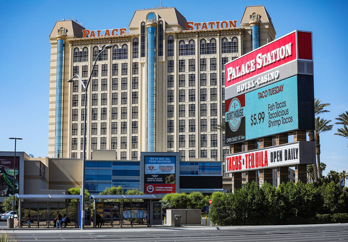 People wait at a bus stop in front of Palace Station in Las Vegas, Sunday, May 15, 2022. Safety ...