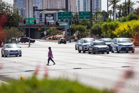 A pedestrian crosses Sahara Avenue in front of Palace Station in Las Vegas, Sunday, May 15, 202 ...