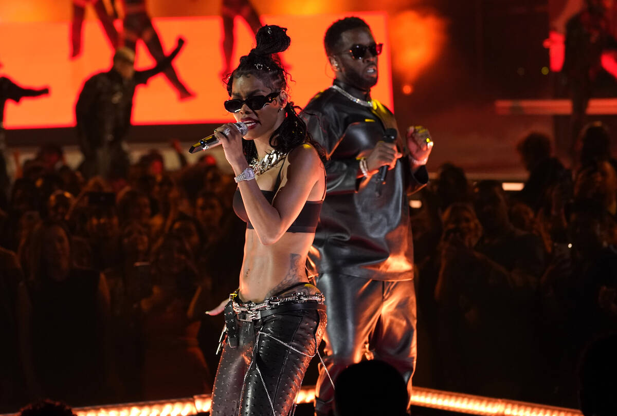 Teyana Taylor, left, and Sean "Diddy" Combs perform at the Billboard Music Awards on ...