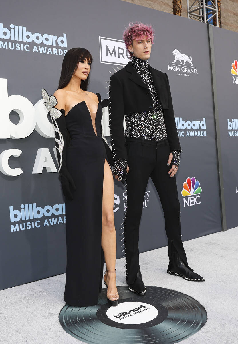 Megan Fox and Machine Gun Kelly pose on the red carpet for the Billboard Music Awards at the MG ...