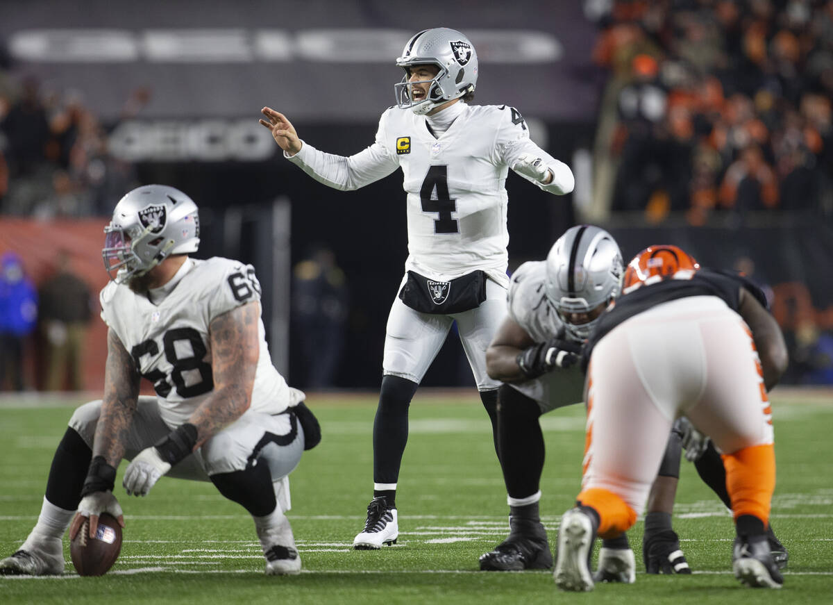 Raiders quarterback Derek Carr (4) calls a play at the line of scrimmage during the second half ...