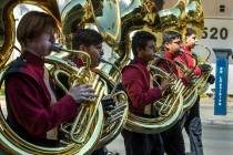 Members of the Dragon Fire Band from the Del Sol Academy of Performing Arts march and play for ...