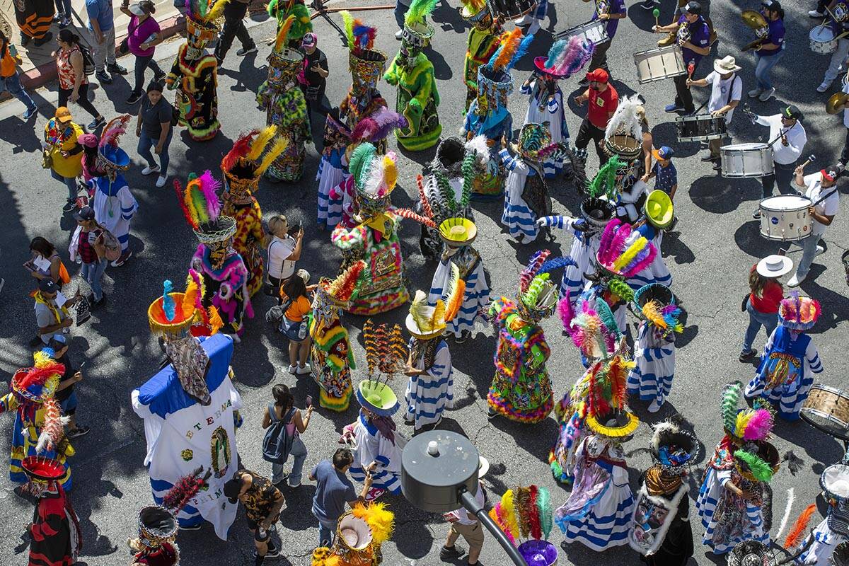 Members of Comparsa Fiesta Morelense perform during the Las Vegas Day Parade as it moves northb ...