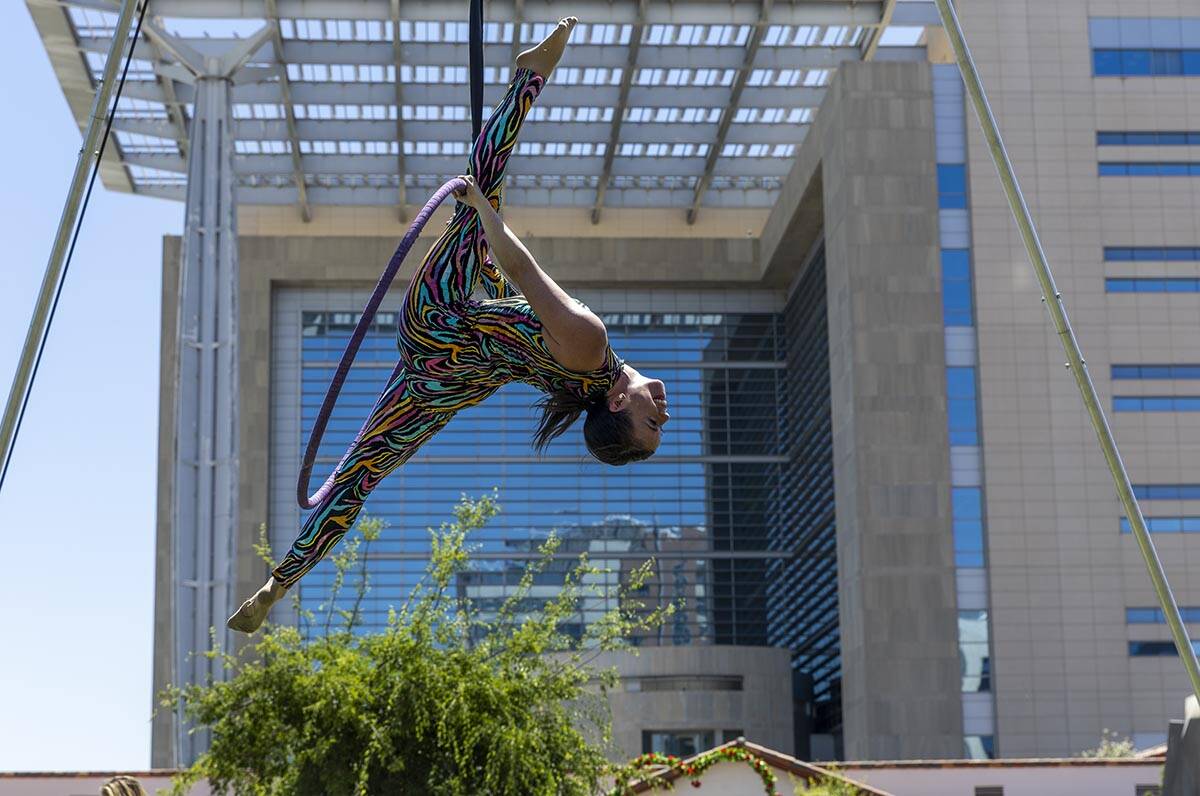 Sarah Cobble with Feel the Music Entertainment performs on a high ring as a festival begins at ...