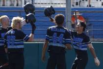 Basic's Tate Southisene (8) is congratulated by teammates, Mason Neville, from left, Chase Ditm ...