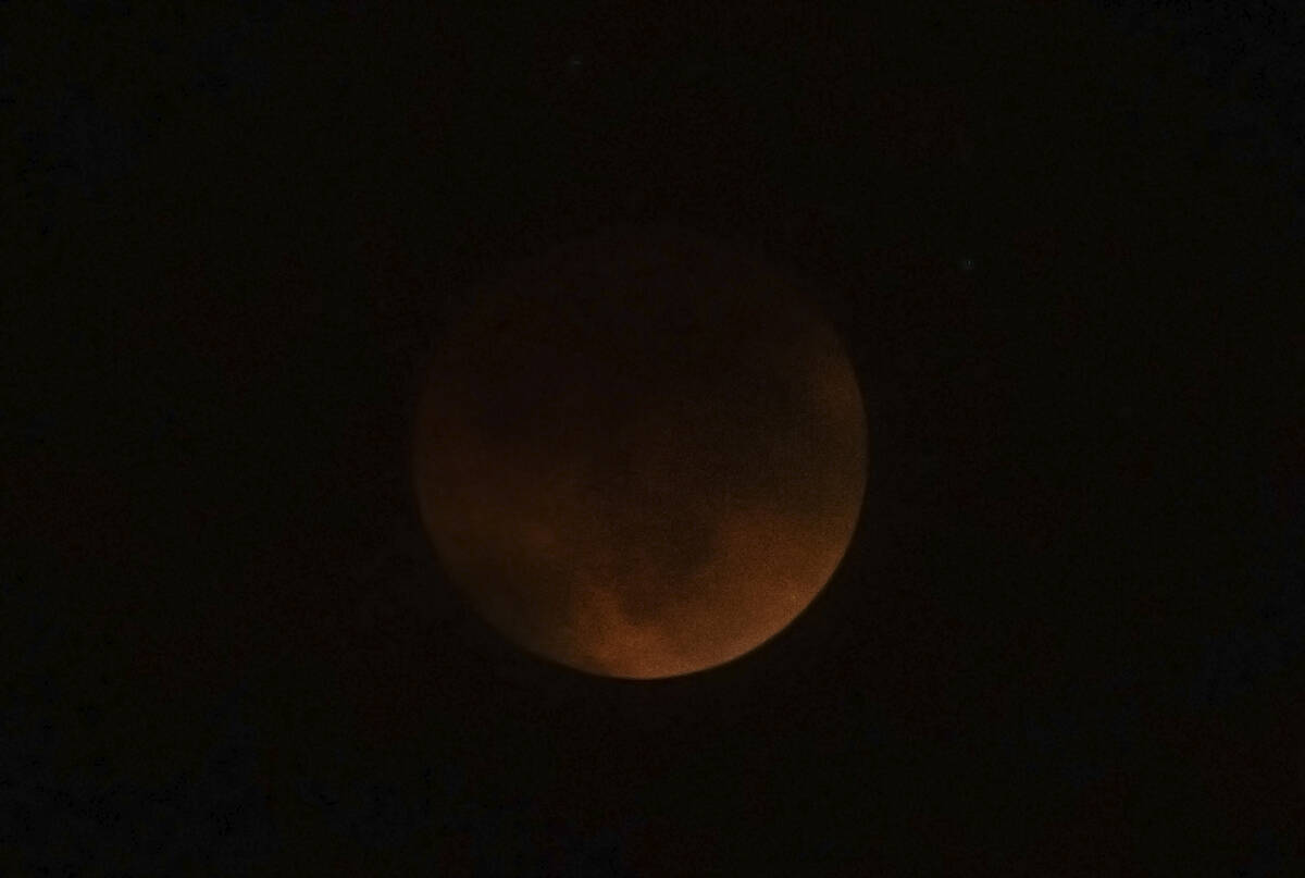 The "Super Flower Blood Moon" lunar eclipse on Sunday, May 15, 2022, in Las Vegas. Heavy cloud ...