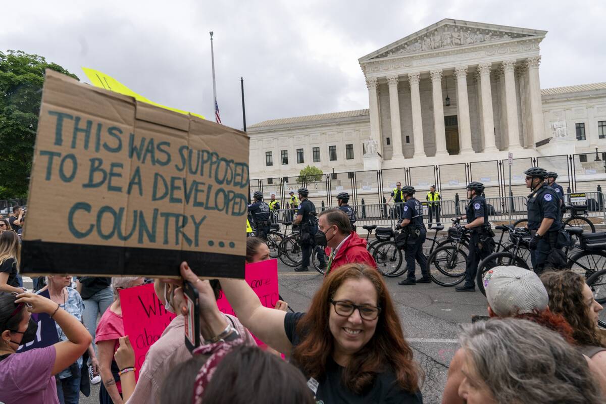 Capitol police officers on bicycles clear abortion demonstrators off the street, Saturday, May ...