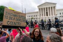 Capitol police officers on bicycles clear abortion demonstrators off the street, Saturday, May ...