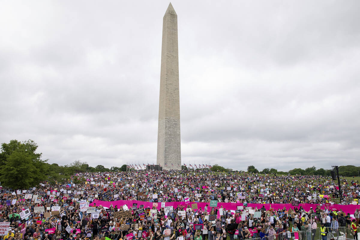 Abortion rights demonstrators rally, Saturday, May 14, 2022, on the National Mall in Washington ...