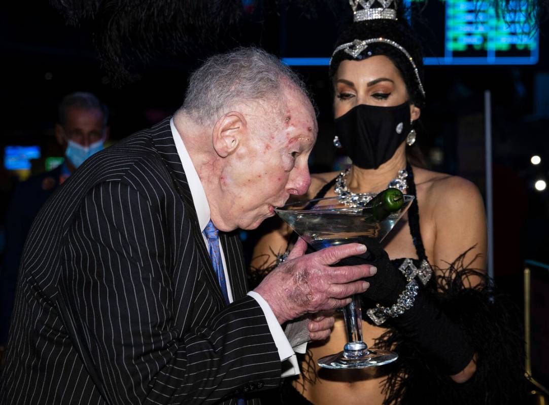 Former Las Vegas Mayor Oscar Goodman sips his martini before placing his March Madness wager ...