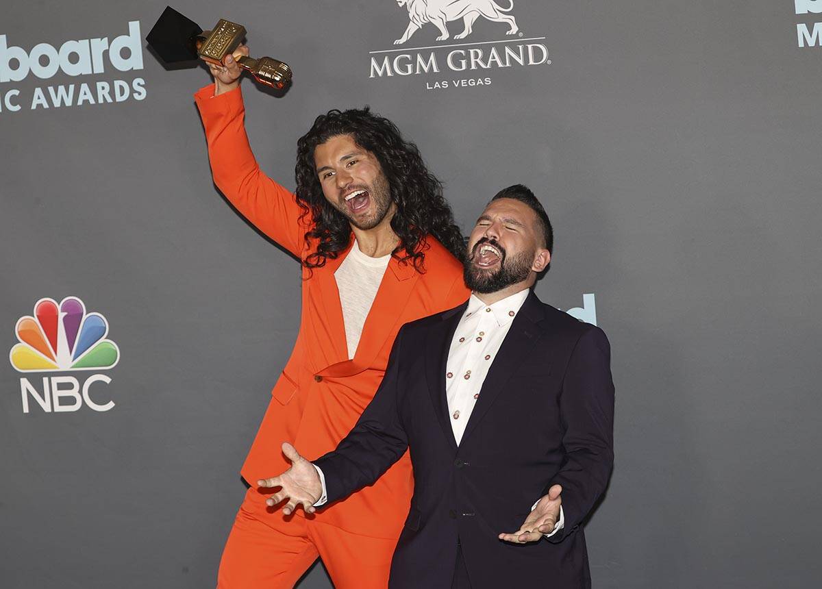 Dan Smyers, left, and Shay Mooney, of duo Dan + Shay, pose with the award for “Top Country Du ...
