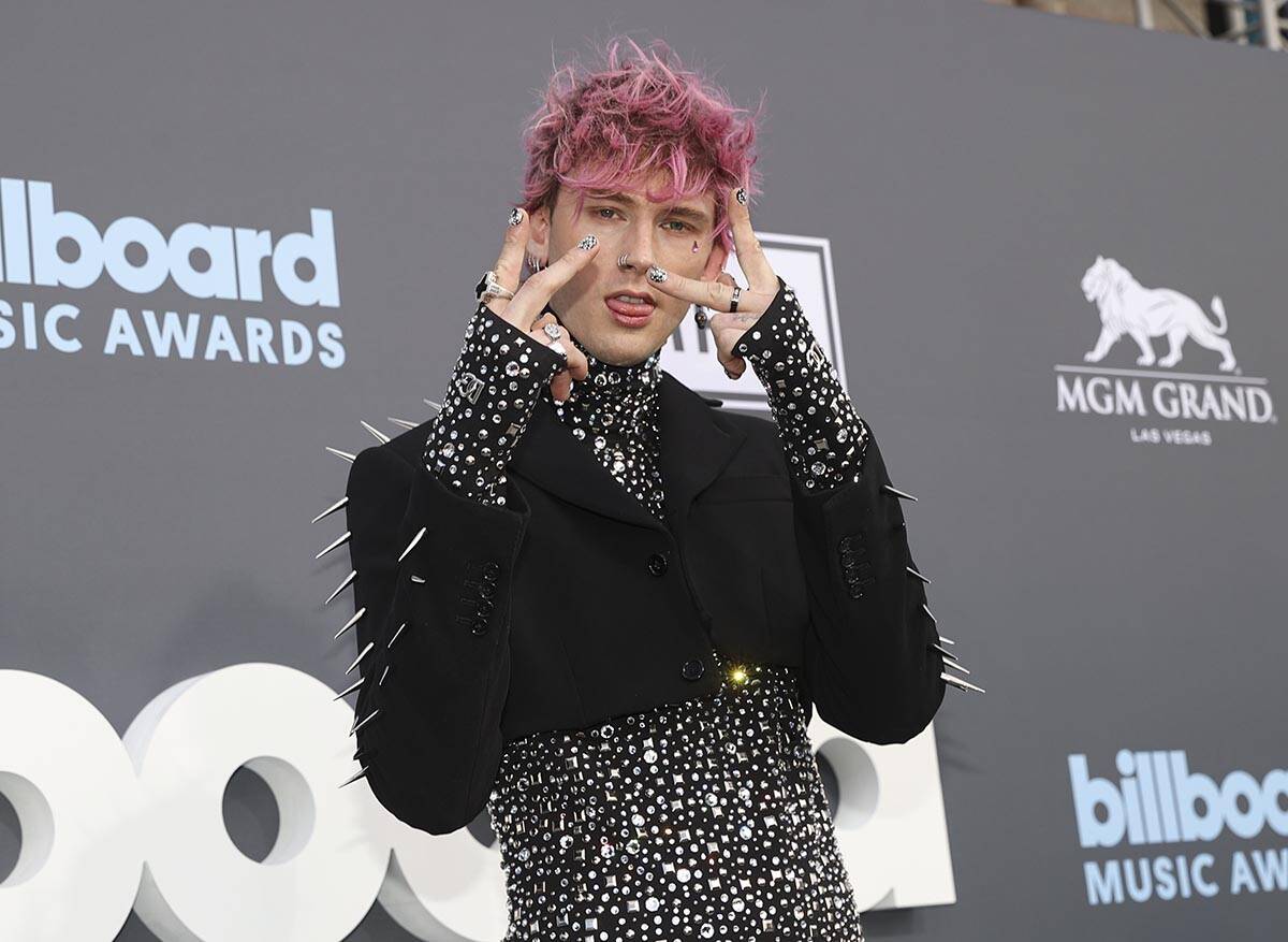 Machine Gun Kelly poses on the red carpet for the Billboard Music Awards at the MGM Grand Garde ...