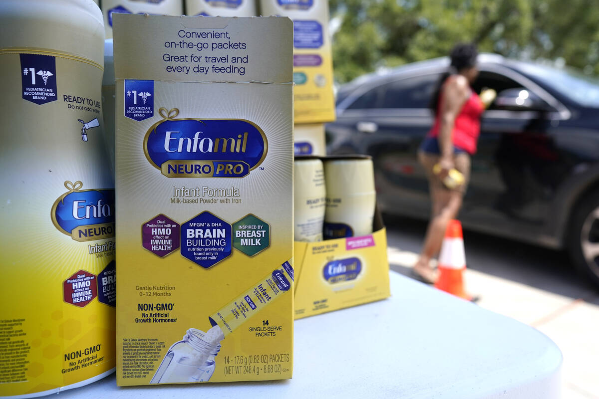 Katherine Gibson-Haynes helps distribute infant formula during a baby formula drive Saturday, M ...