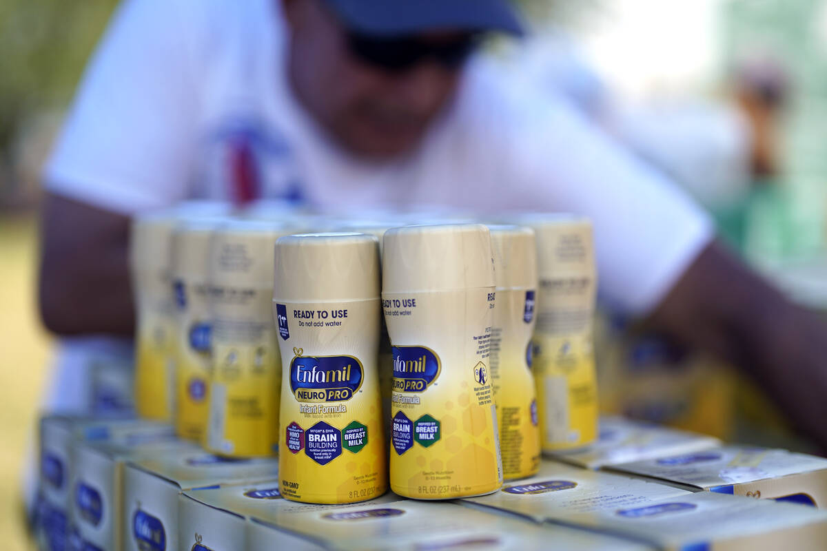 Infant formula is stacked on a table during a baby formula drive to help with the shortage Satu ...