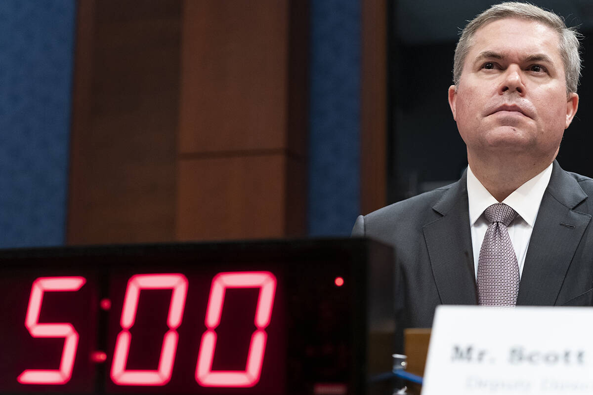 Deputy Director of Naval Intelligence Scott Bray listens during a hearing of the House Intellig ...