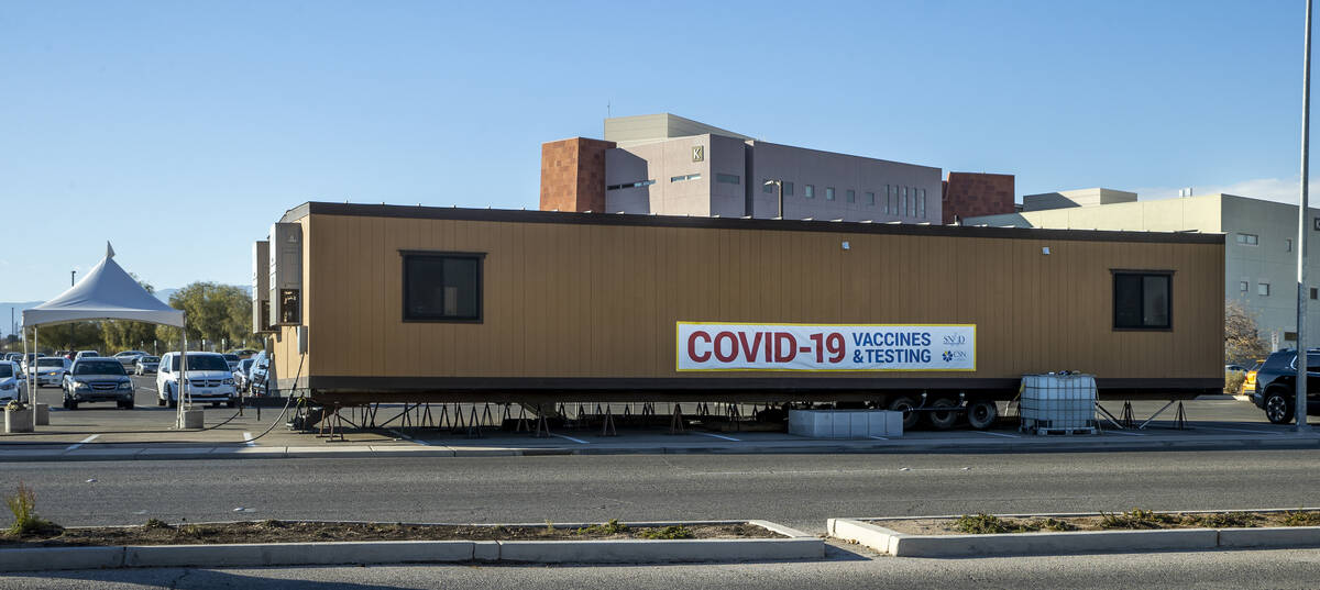 People wait and are served for COVID-19 testing at the CSN West Charleston campus on Tuesday, J ...