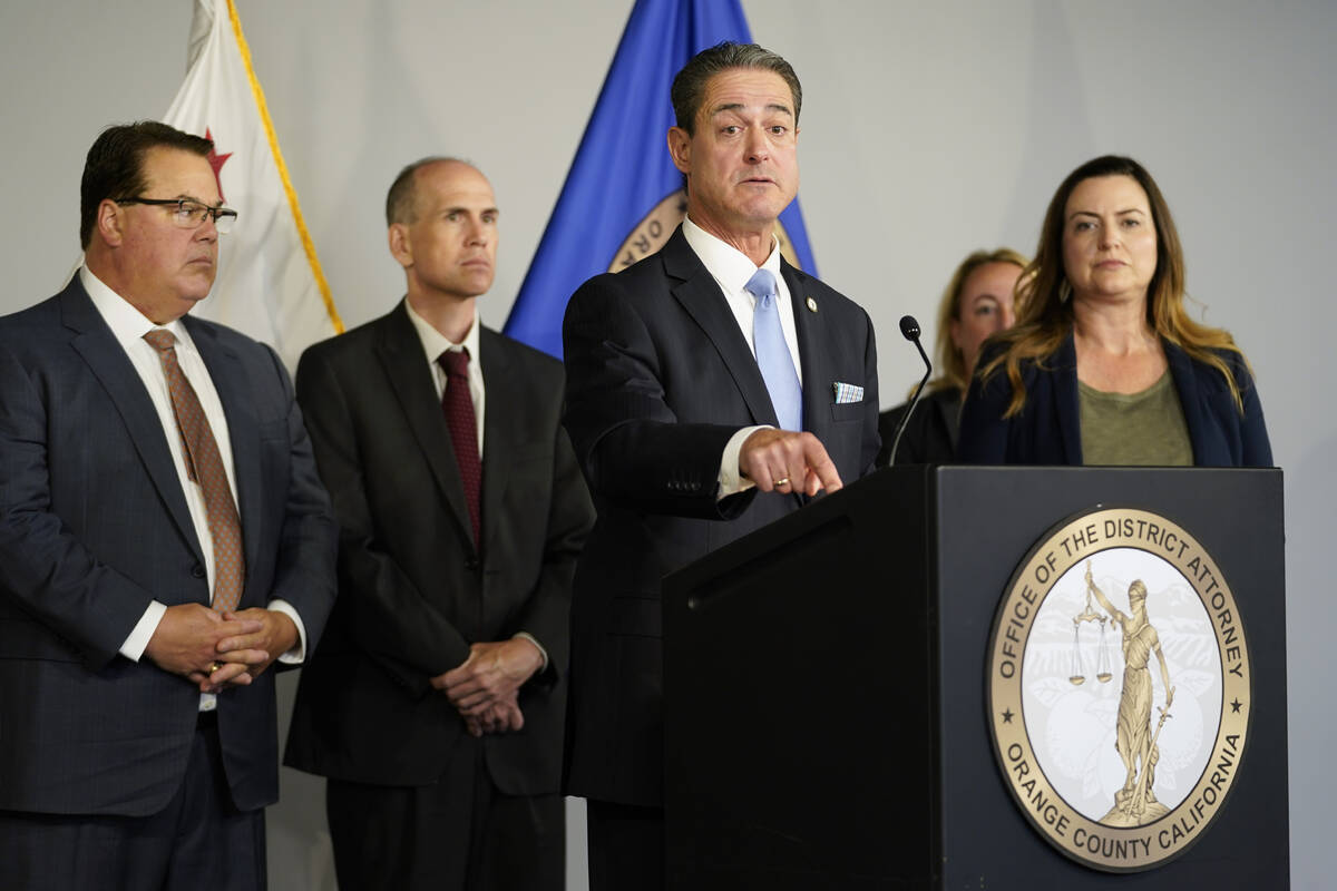 Orange County District Attorney Todd Spitzer, center, speaks during a news conference on Tuesda ...