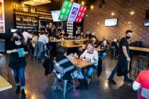 Guests enjoy dinner at El Luchador Mexcian Kitchen + Cantina on Friday, March 12, 2021, in Las ...
