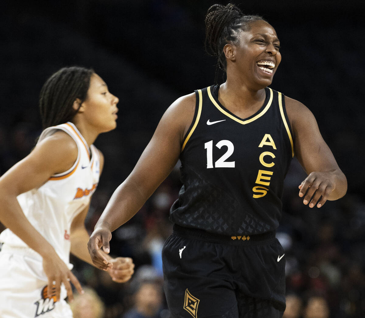 Aces guard Chelsea Gray (12) celebrates a big play in the second half during a WNBA basketball ...