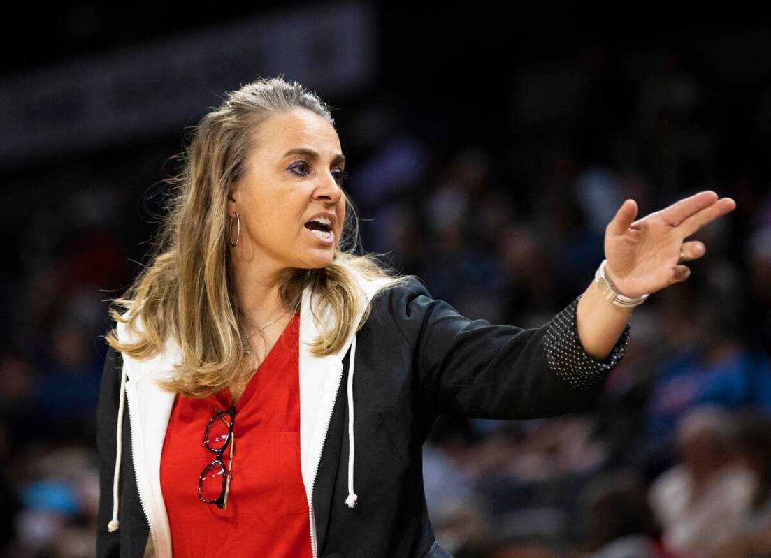 Aces head coach Becky Hammon directs her team in the second half during a WNBA basketball game ...