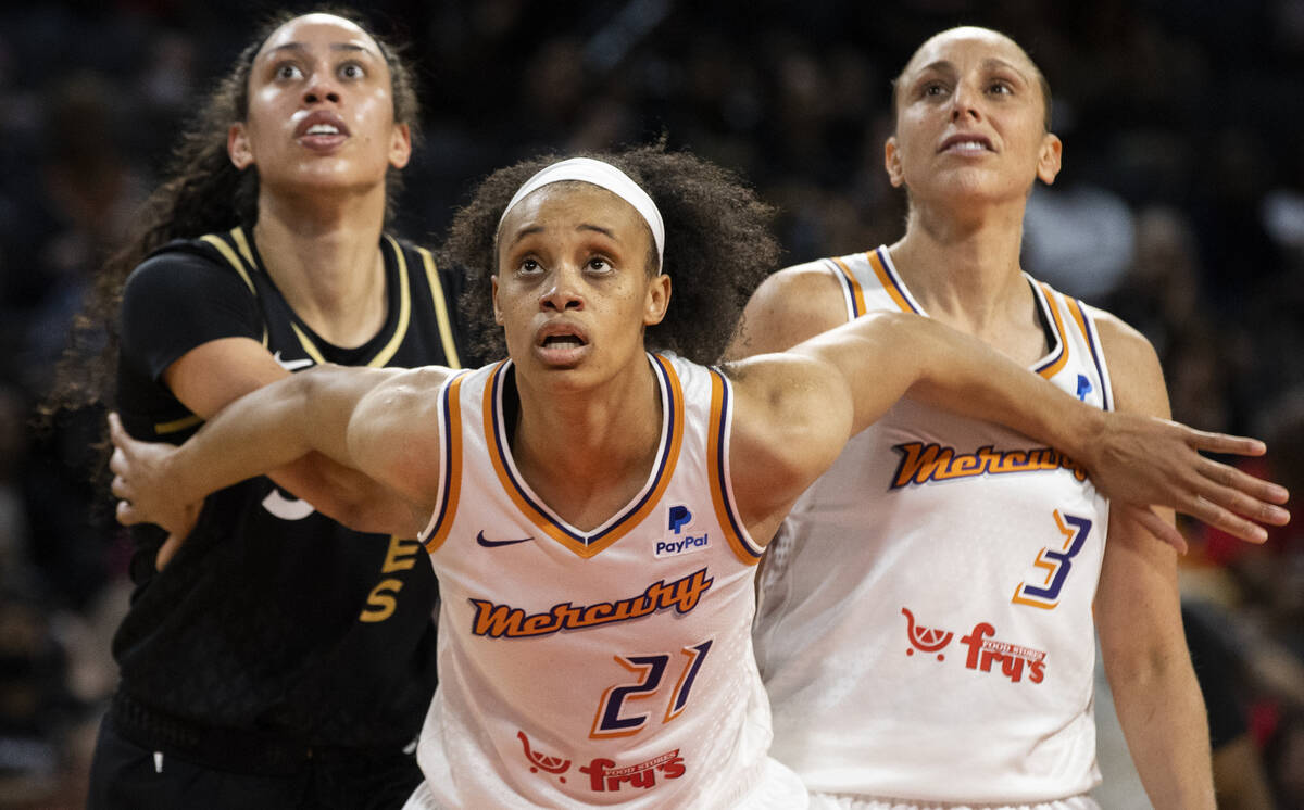 Phoenix Mercury forward Brianna Turner (21) and Phoenix Mercury guard Diana Taurasi (3) box out ...