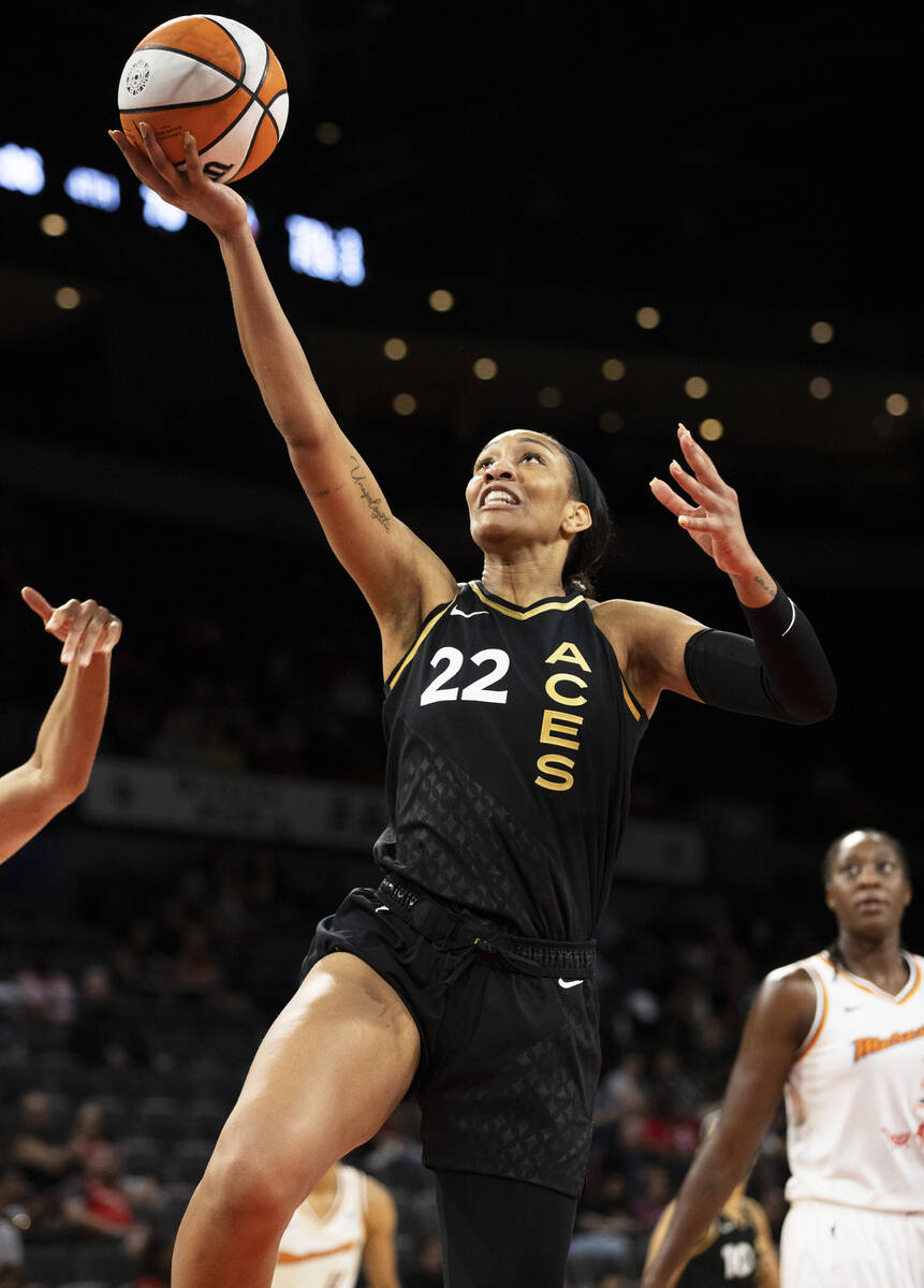 Aces forward A'ja Wilson (22) drives to the basket in the second half during a WNBA basketball ...