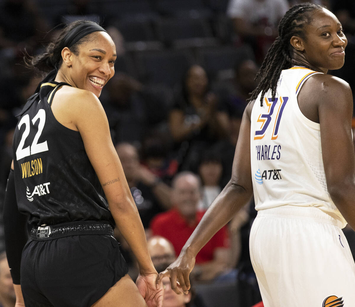 Aces forward A'ja Wilson (22) shares a moment with Phoenix Mercury center Tina Charles (31) in ...