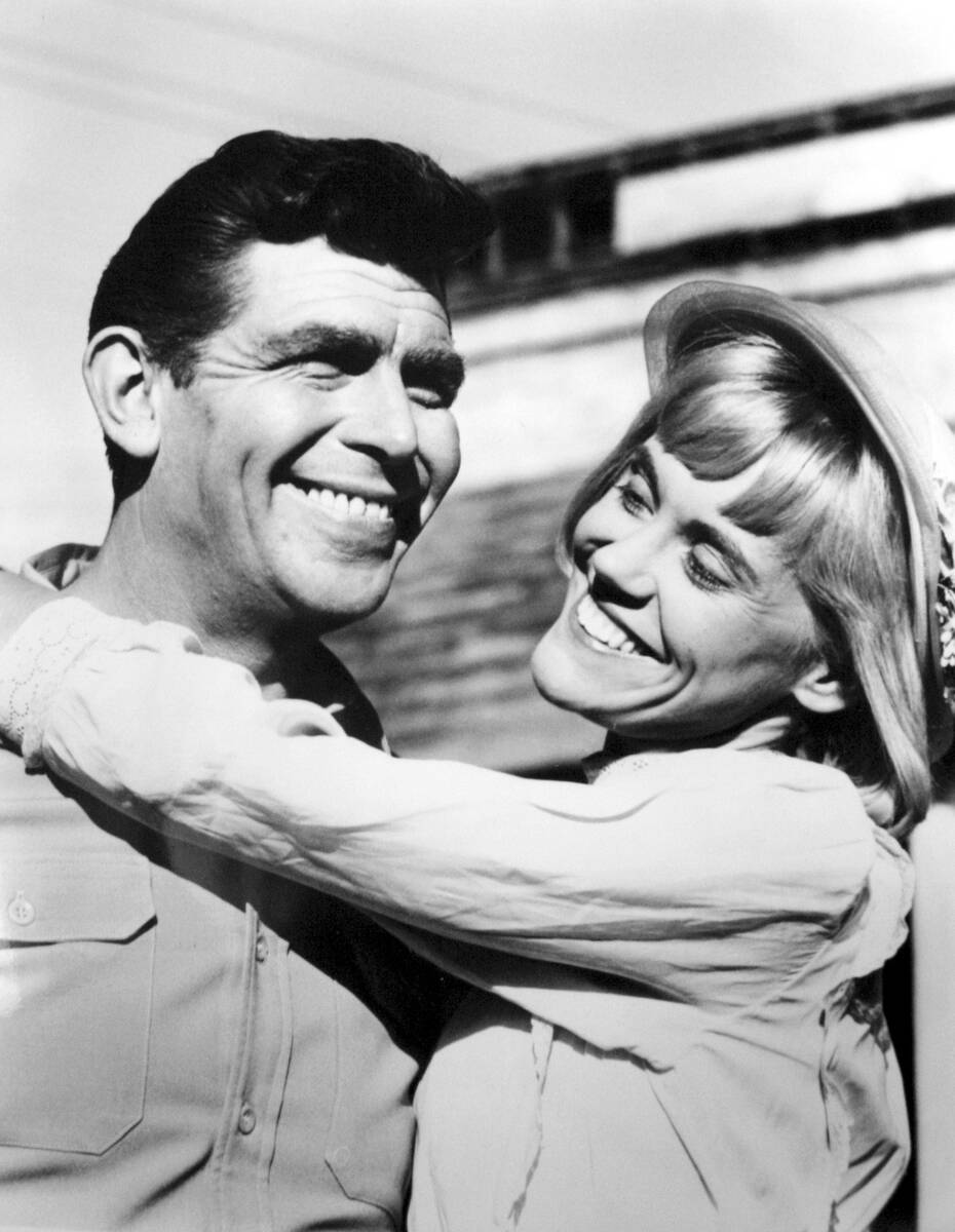 Actor/comedian Andy Griffith playing himself, left, hugs his TV girlfriend actress/musician Mag ...