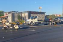 A tow truck removes a vehicle Wednesday, May 18, 2022, from a Tuesday night crash that injured ...