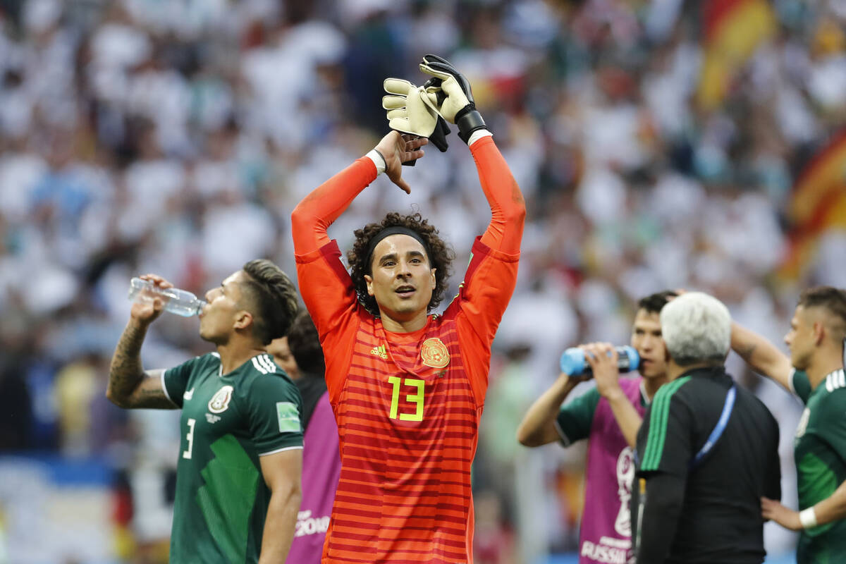 Mexico goalkeeper Guillermo Ochoa celebrates after winning the group F match between Germany an ...