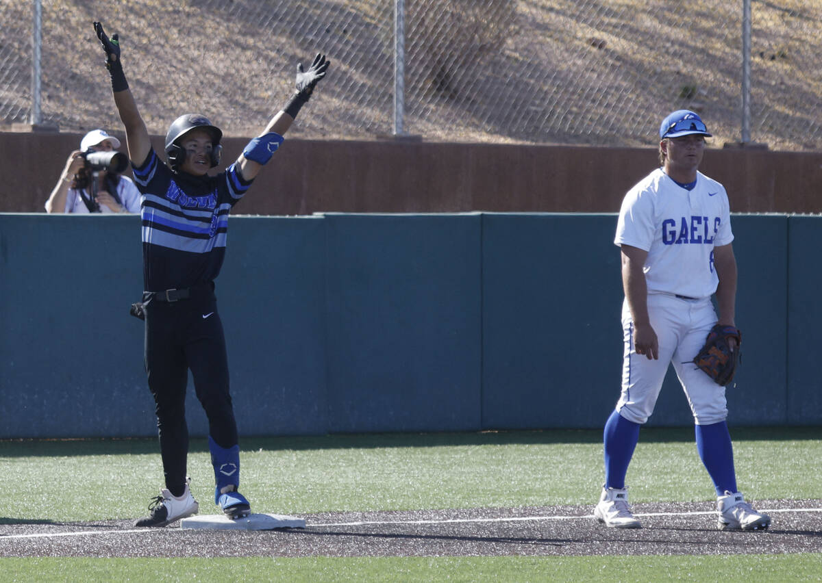 Basic's Ty Southisene (3) gestures after he reached the third base as Bishop Gorman's Gunnar My ...