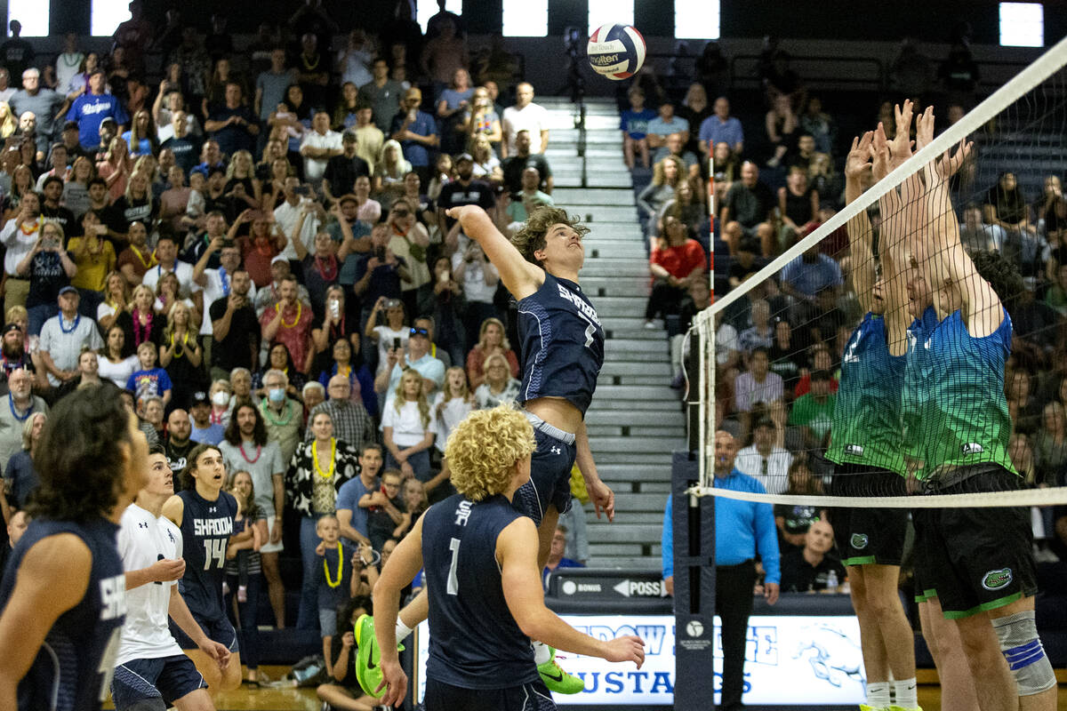 Shadow Ridge middle blocker Tyler Kirk spikes the winning point against Green Valley during the ...