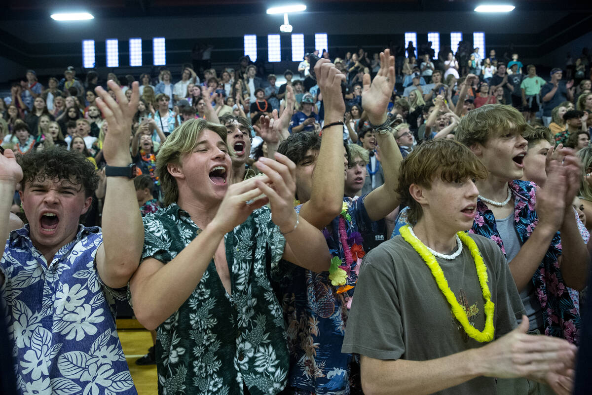 Shadow Ridge fans cheer after their team won the Class 5A boys volleyball state championship ma ...